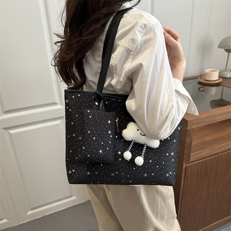 Women's large tote bag with sparkling star design and detachable cosmetic pouch