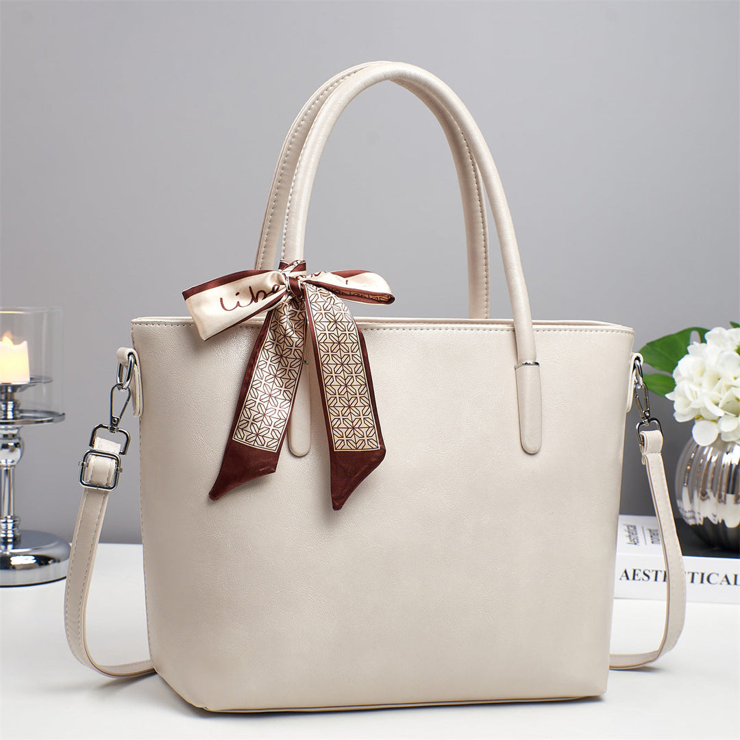 Women's elegant shoulder bag with playful bow accent
