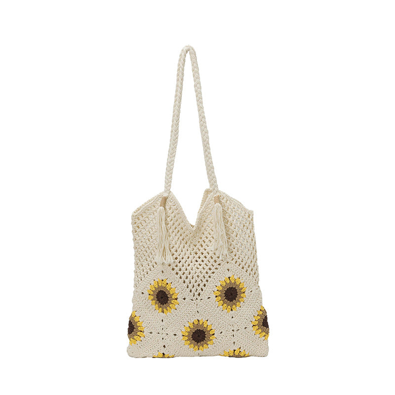 Ladies crocheted shoulder bag with playful sunflower appliqués