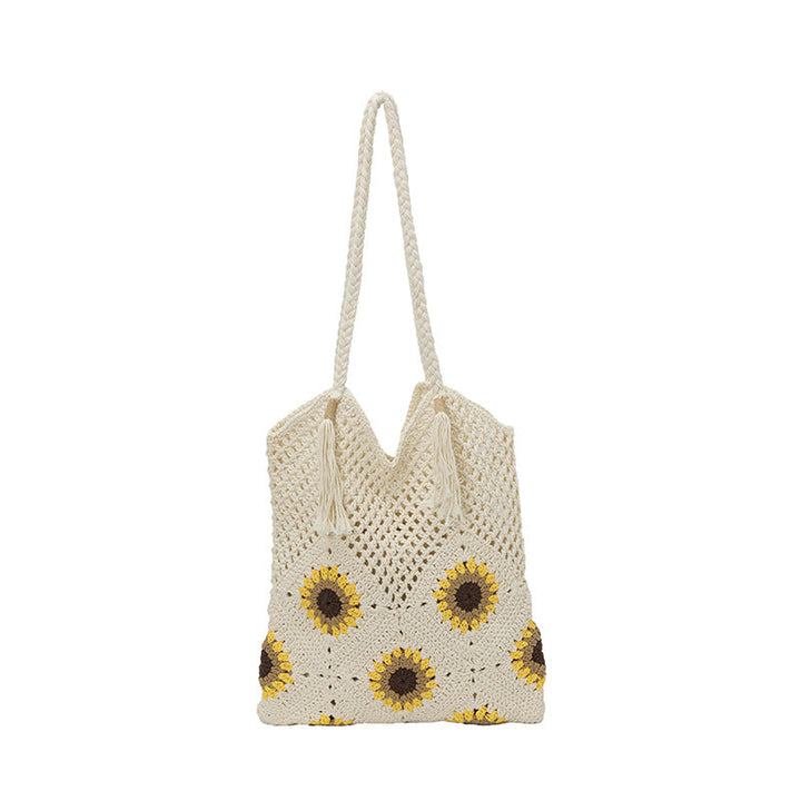 Ladies crocheted shoulder bag with playful sunflower appliqués