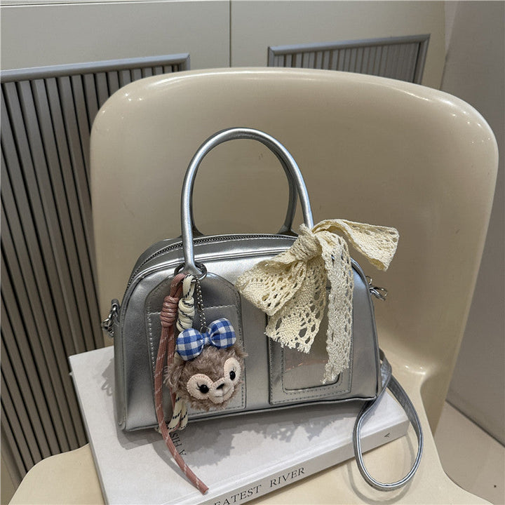 Ladies Mini Handbag with playful animal motif and charming charm