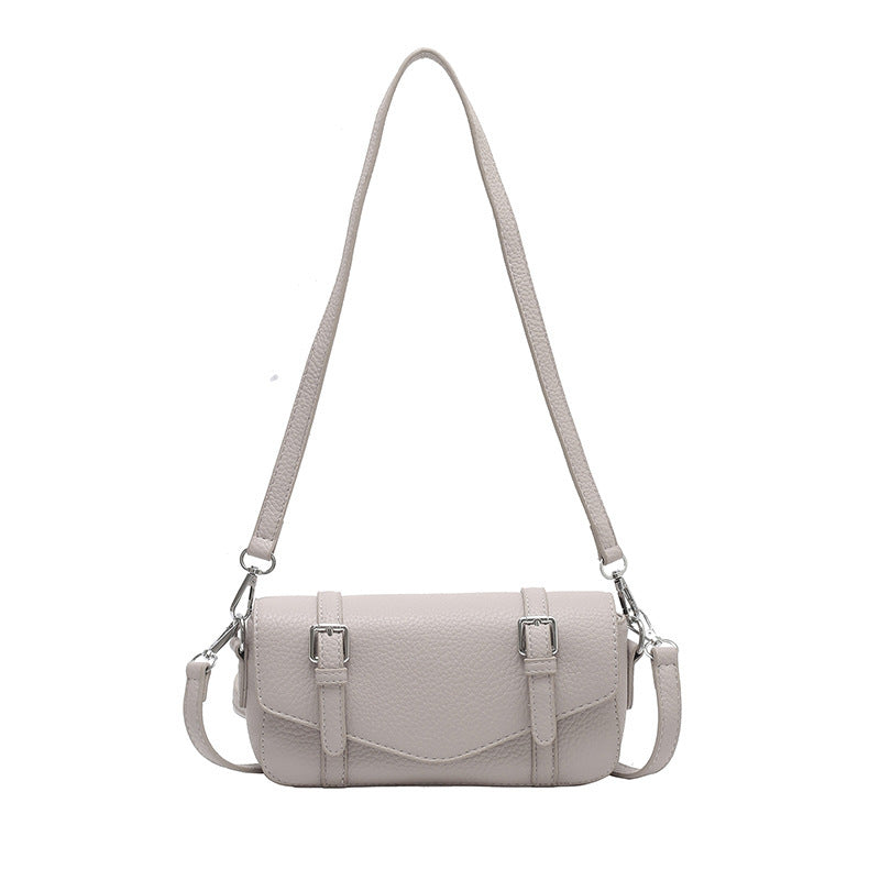 Women's elegant shoulder bag made of textured synthetic leather with adjustable shoulder strap
