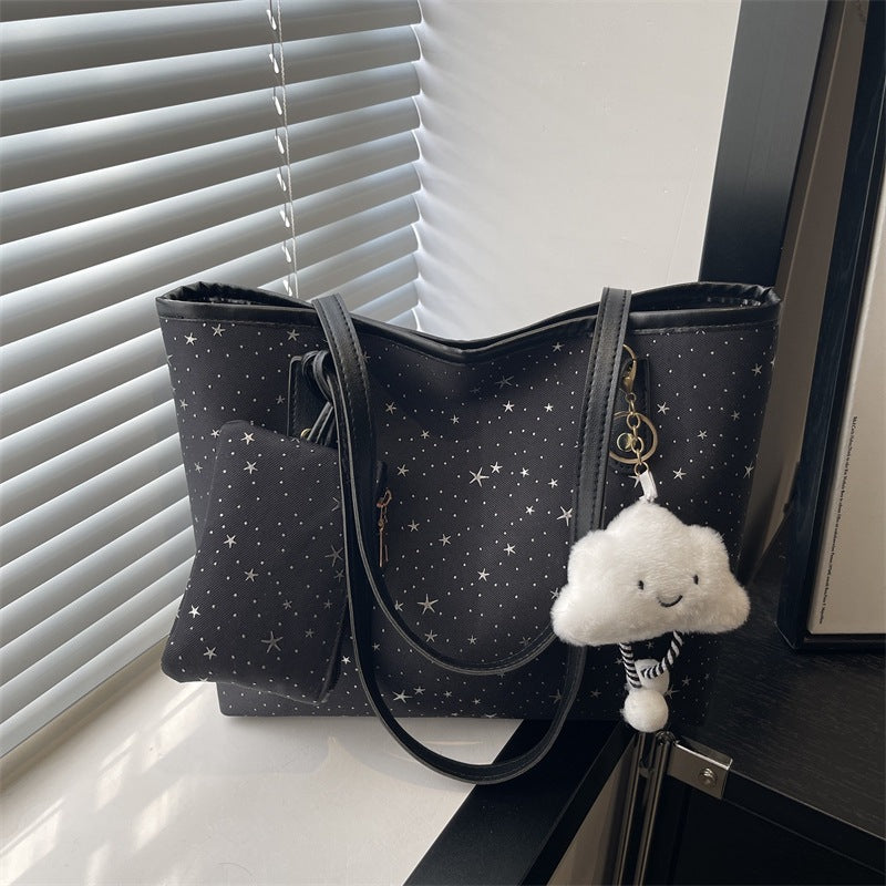Women's large tote bag with sparkling star design and detachable cosmetic pouch