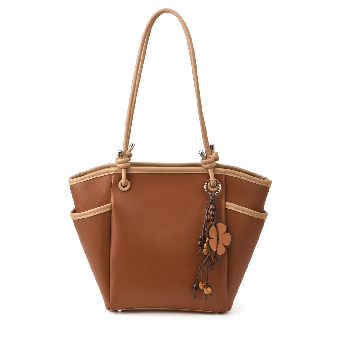 Women's practical shoulder bag with charming appliqués