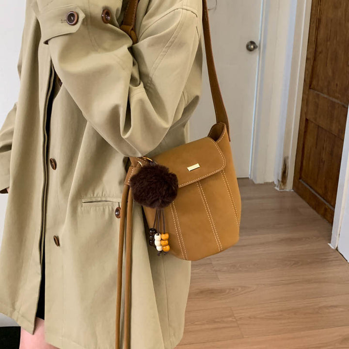 Ladies fashionable crossbody bag with fluffy pendant
