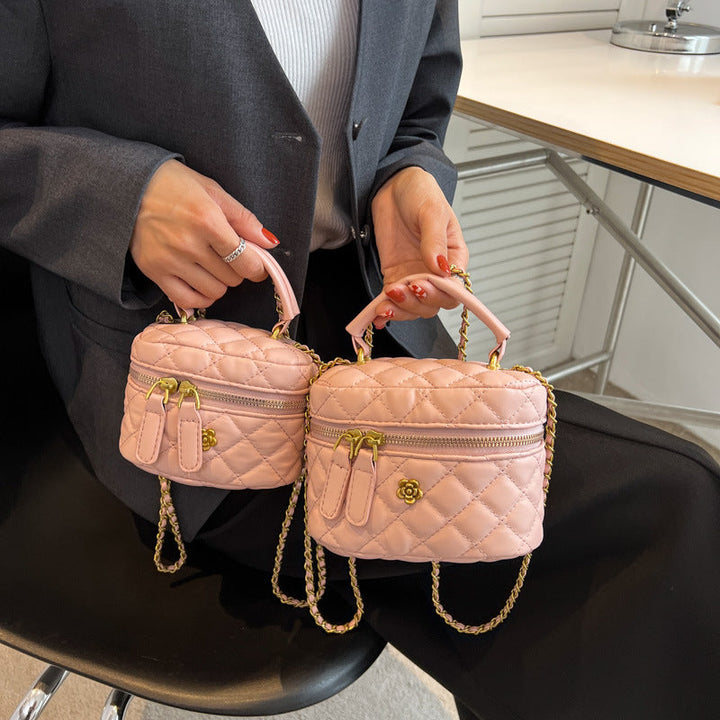 Women's mini bag in elegant quilted design with golden accents