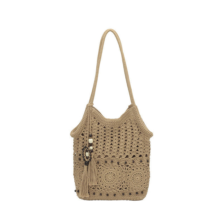 Ladies crocheted shoulder bag with decorative fringes and unique accents