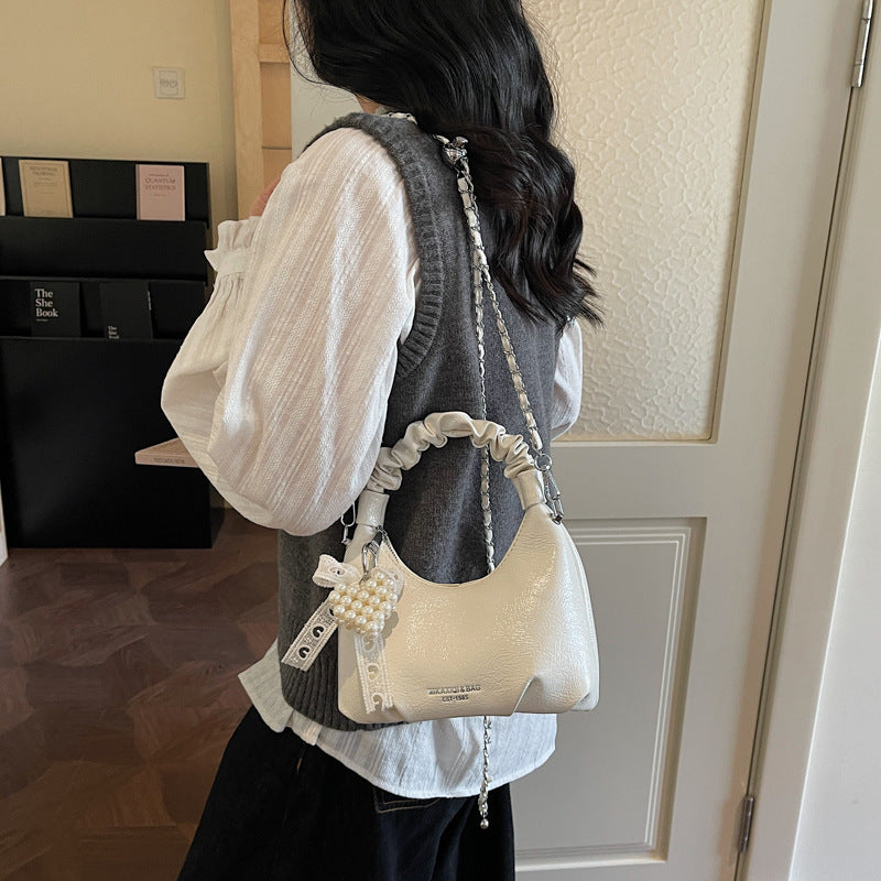 Ladies mini handbag with voluminous ruffle design and trendy charms