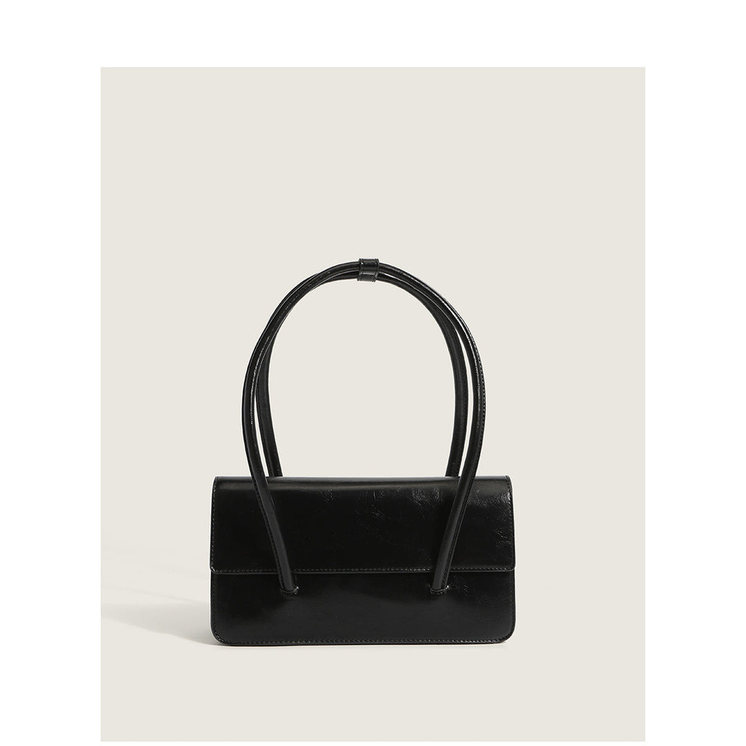 Ladies elegant handbag with minimalist silhouette