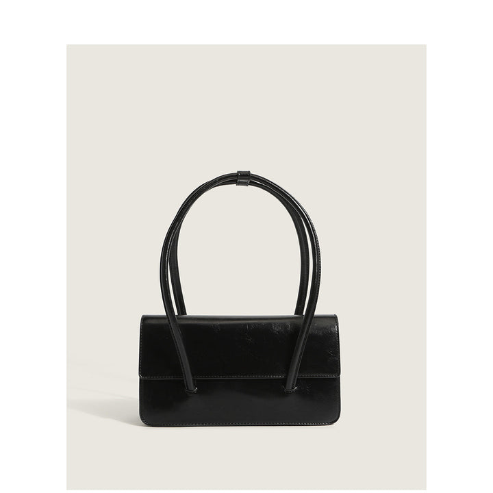 Ladies elegant handbag with minimalist silhouette