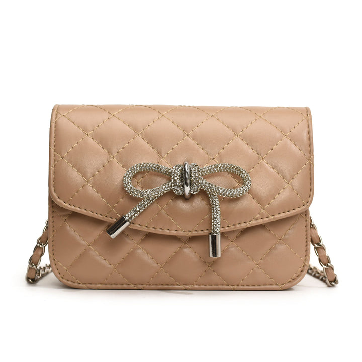 Ladies mini handbag with luxurious quilted pattern and sparkling chain pendant