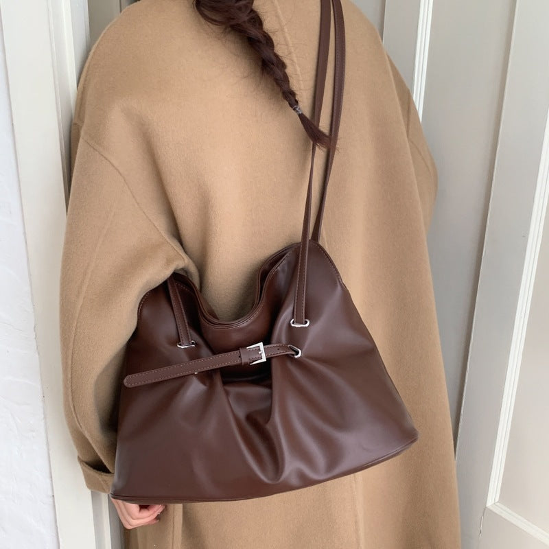Women's shoulder bag made of high-quality synthetic leather with adjustable drawstring