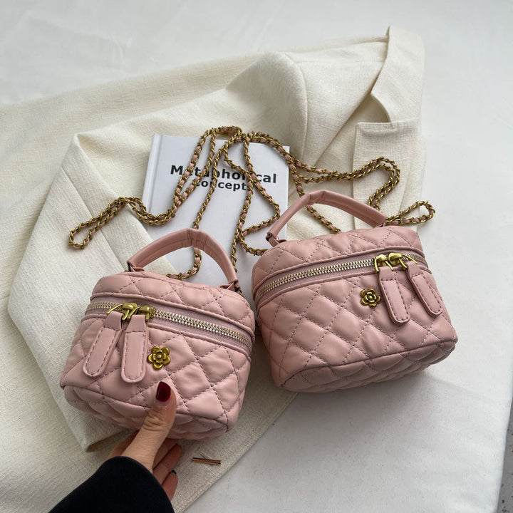 Women's mini bag in elegant quilted design with golden accents