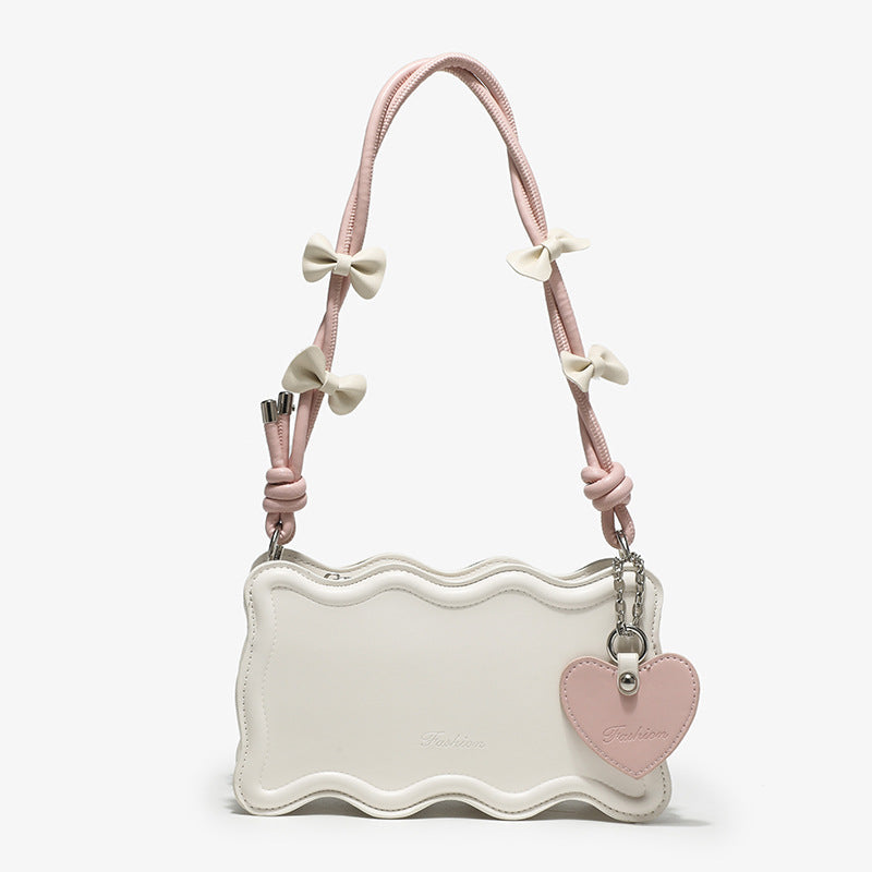 Women's mini handbag with creative wave pattern and playful pendant
