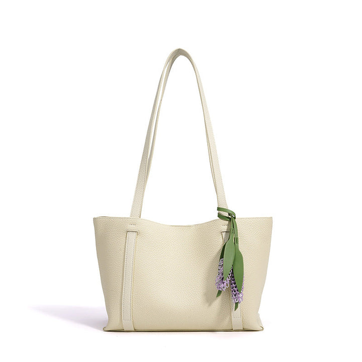 Ladies stylish tote bag with floral pendant
