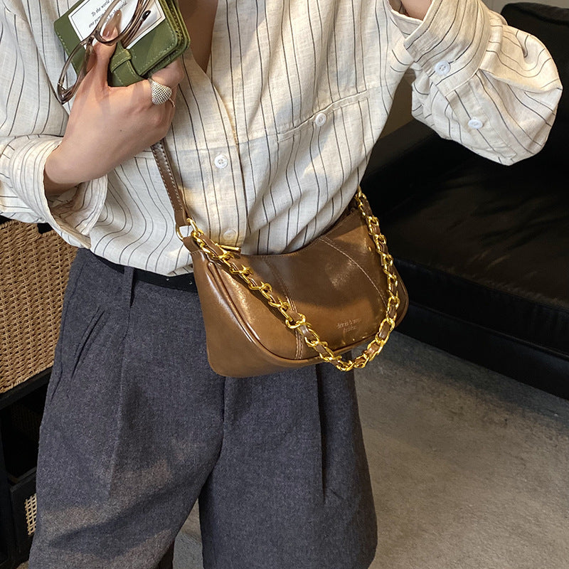 Women's shoulder bag with elegant chain accent