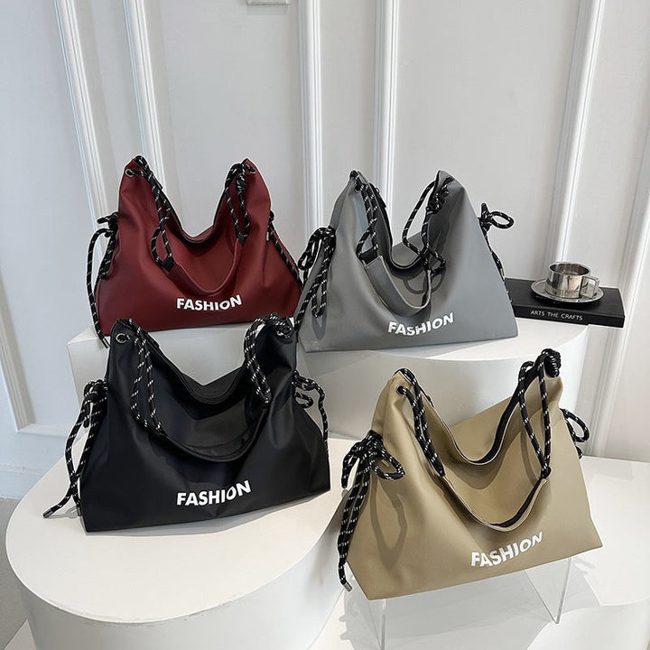 Women's stylish tote bag with braided drawstring