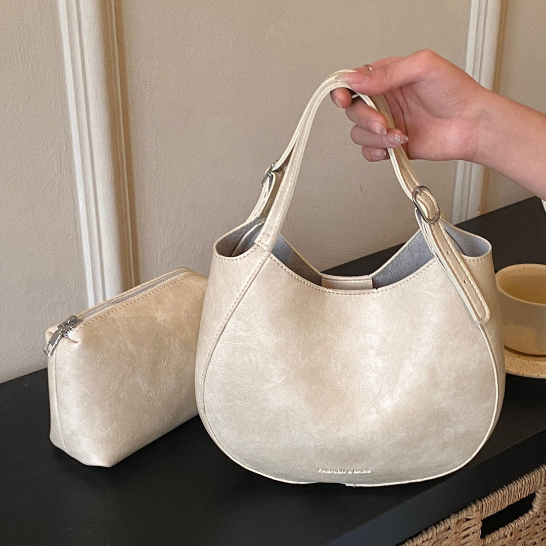 Women's shoulder bag made of high-quality artificial leather with fashionable trim