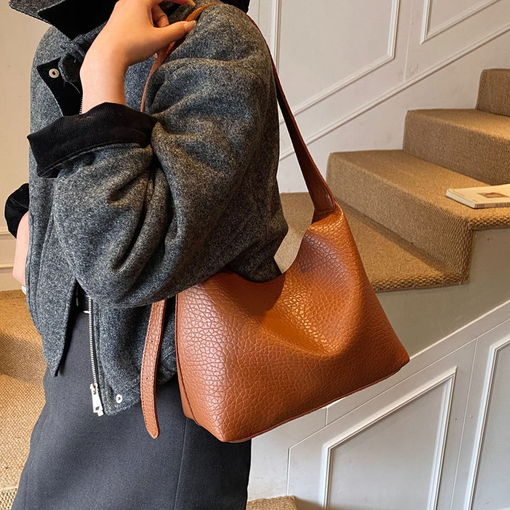 Women stylish shoulder bag with textured design