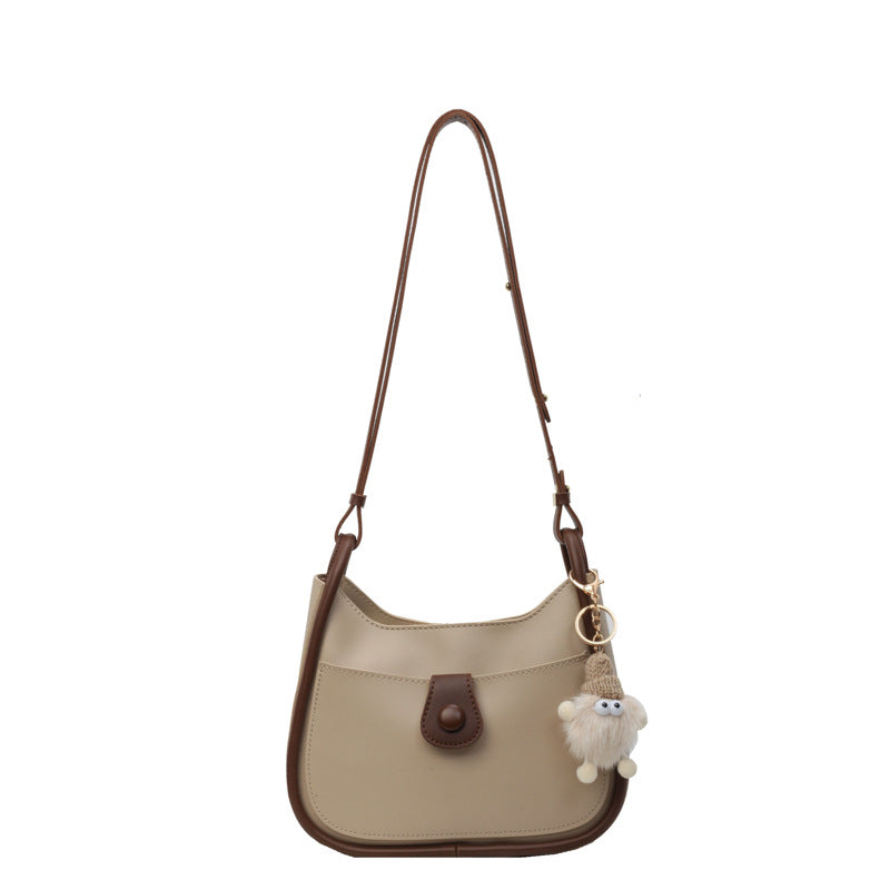 Women's shoulder bag made of high-quality synthetic leather with playful charm