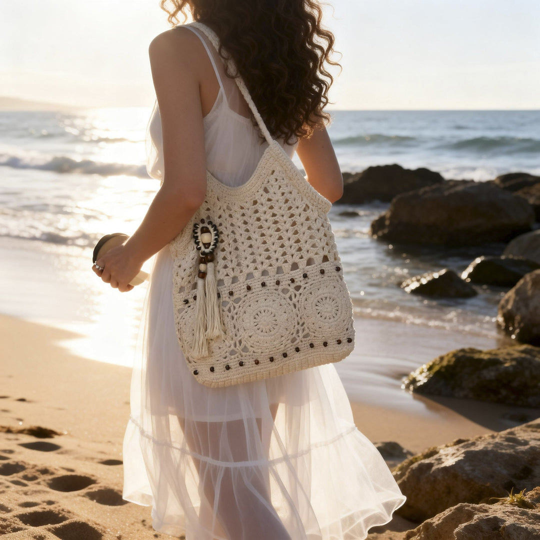 Ladies crocheted shoulder bag with decorative fringes and unique accents