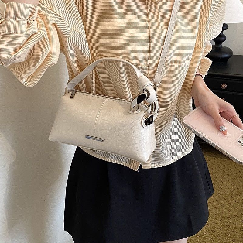 Ladies elegant handbag with minimalist design and noble accents