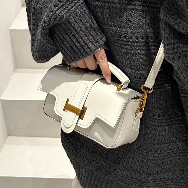 Ladies elegant mini handbag with practical carrying handle and removable shoulder strap
