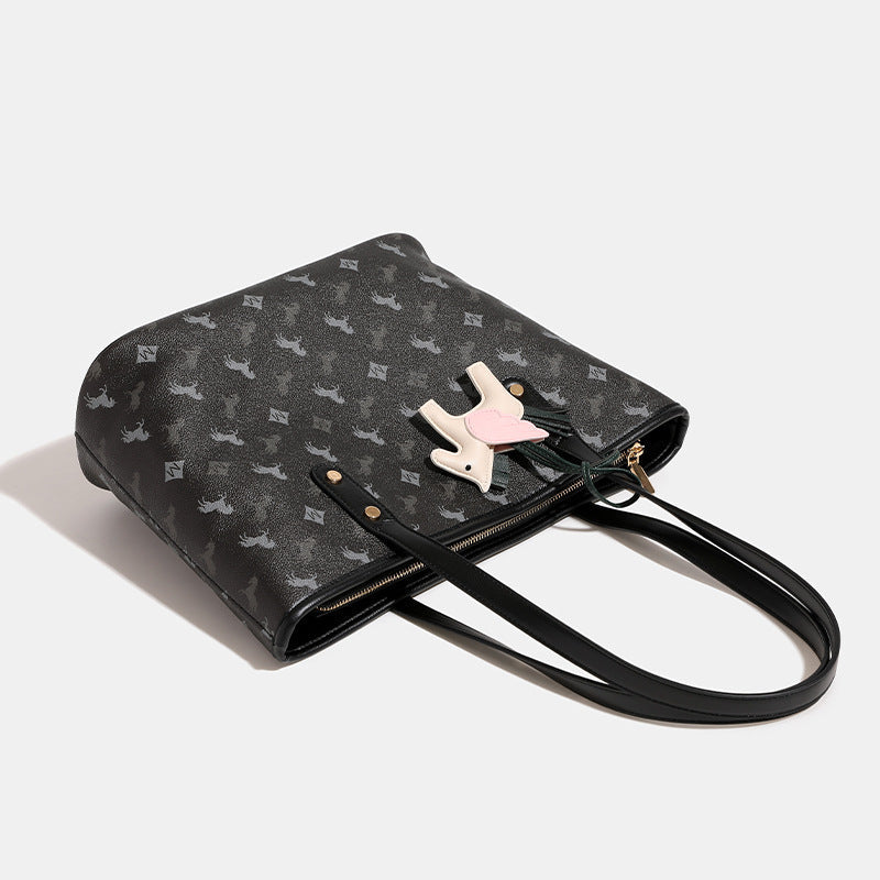 Women's casual tote bag with playful design and detachable pendant