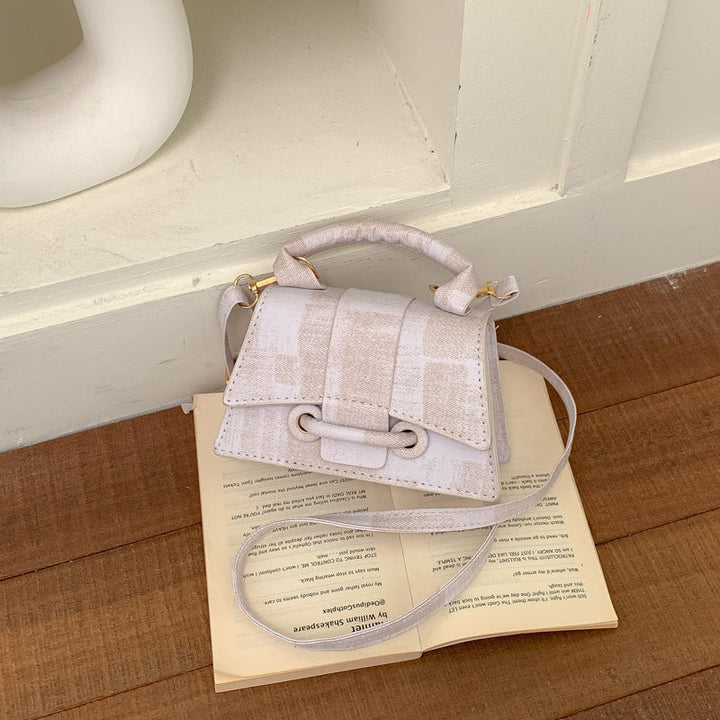 Women's elegant mini handbag with textured design
