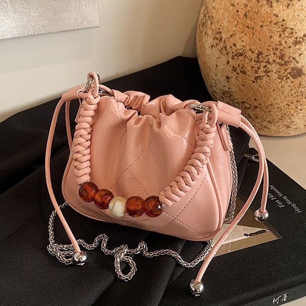 Ladies mini shoulder bag with decorative chain strap and trendy charm