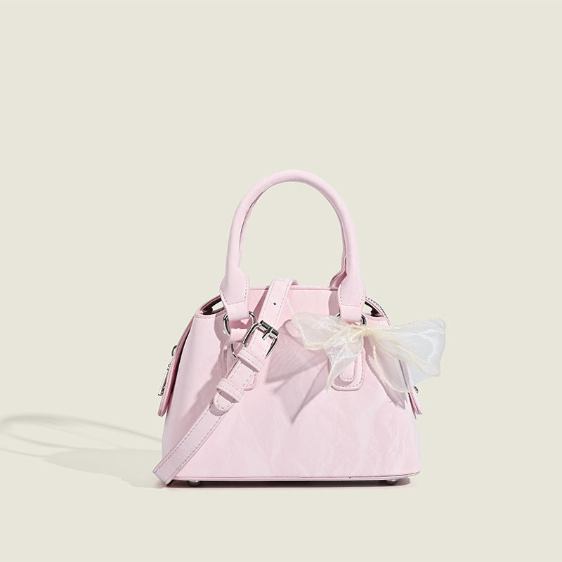Women’s mini handbag with playful bow accent