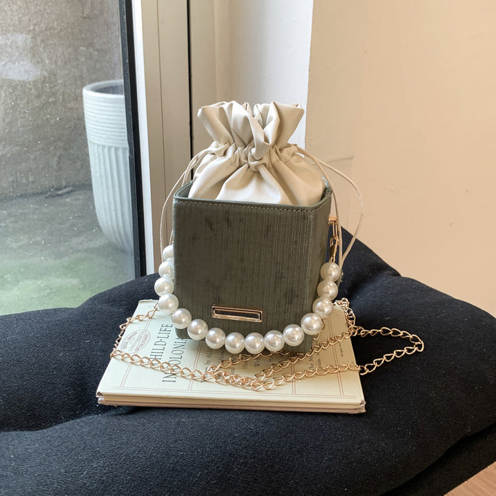 Ladies stylish mini handbag with drawstring and pearl accent