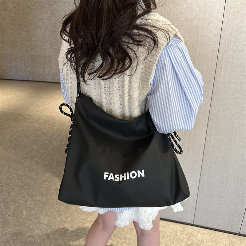 Women's stylish tote bag with braided drawstring