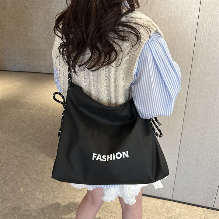 Women's stylish tote bag with braided drawstring