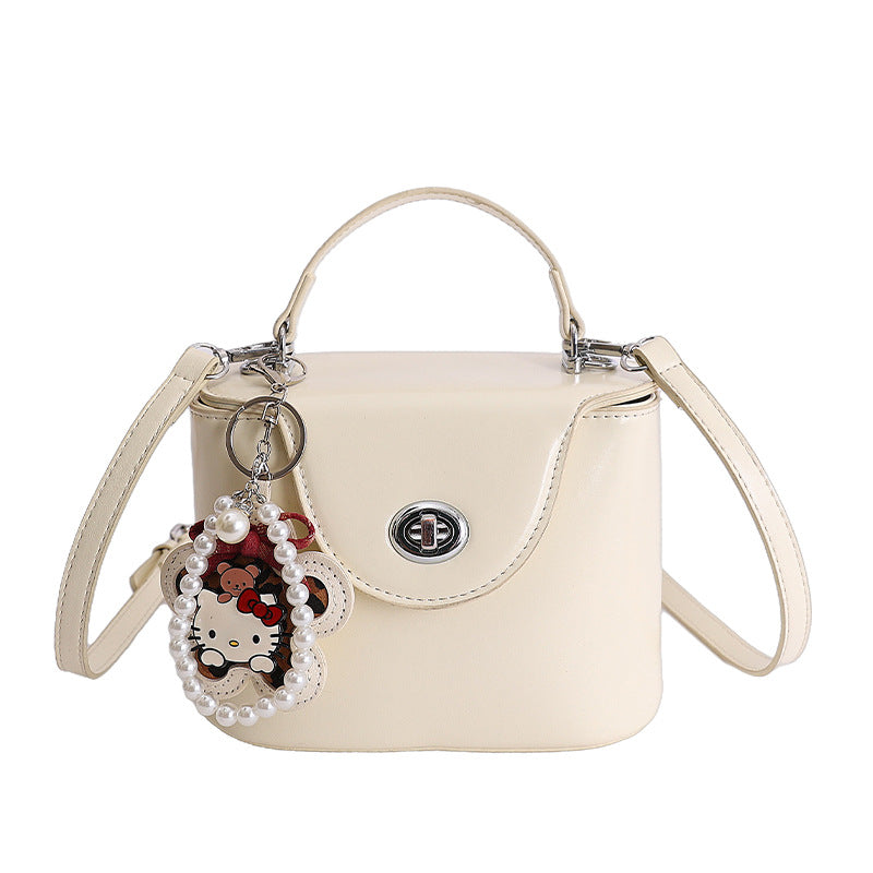 Ladies elegant mini handbag with stylish charm