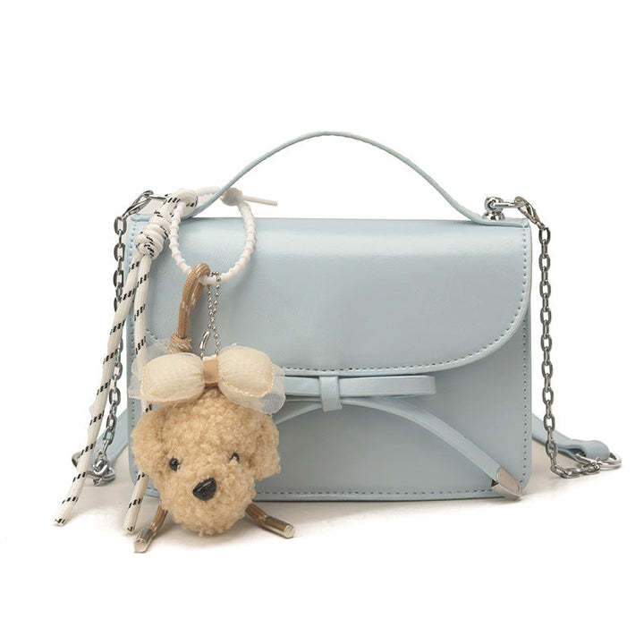 Women elegant mini handbag with cute pendant