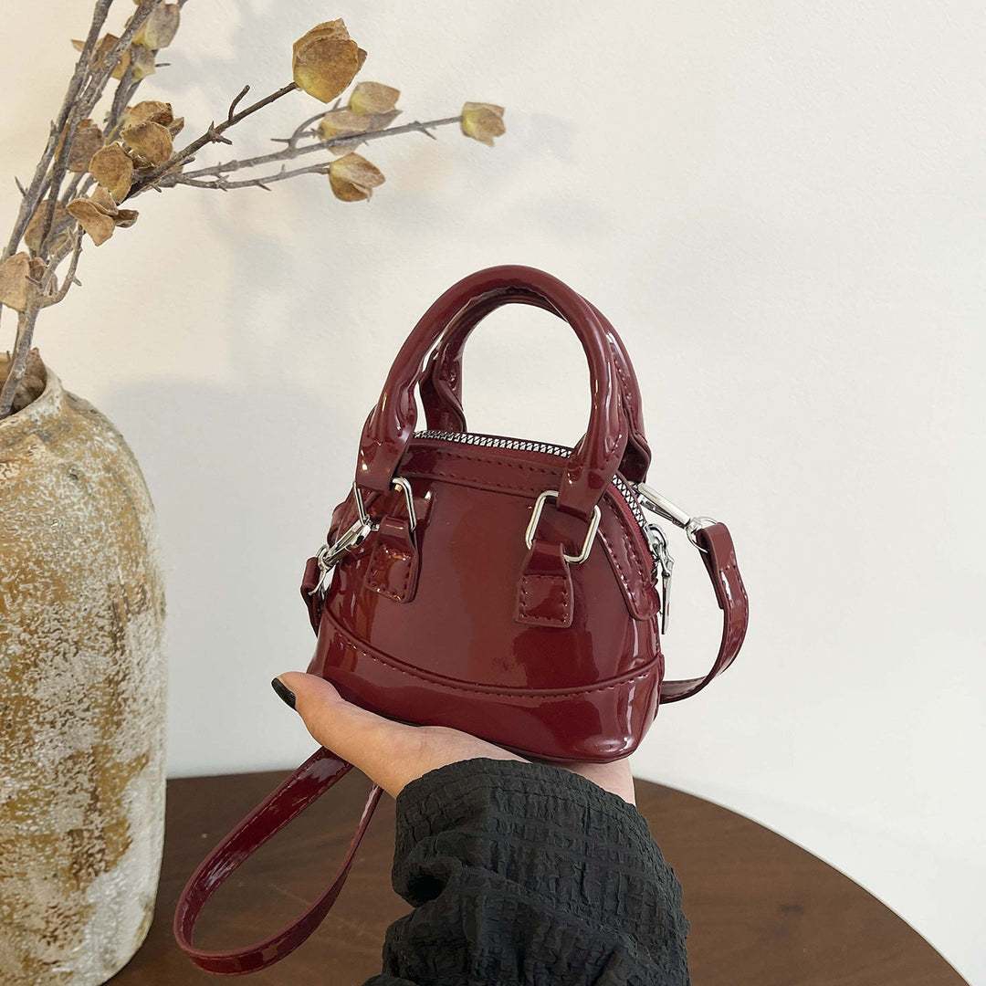 Women's mini handbag with glossy surface and fashionable zipper