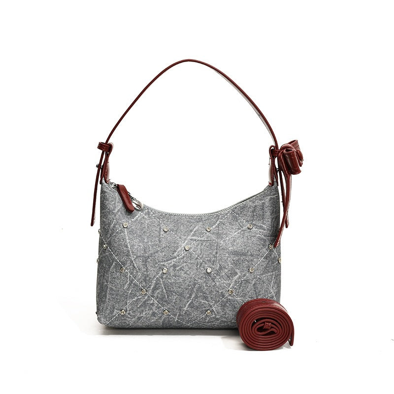 Ladies fashionable shoulder bag with sparkling appliqués