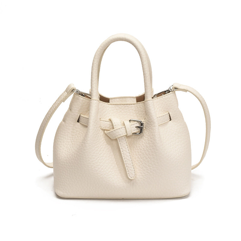 Women's mini handbag with stylish button closure