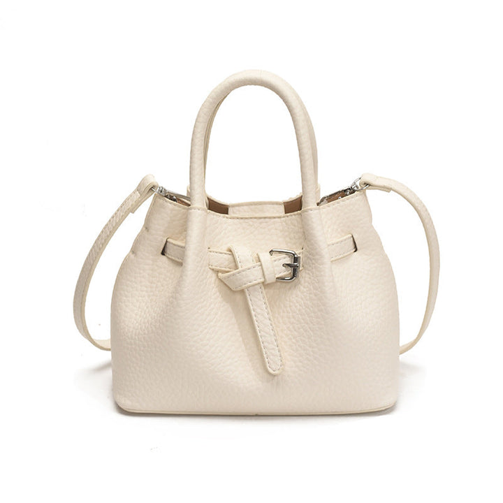 Women's mini handbag with stylish button closure