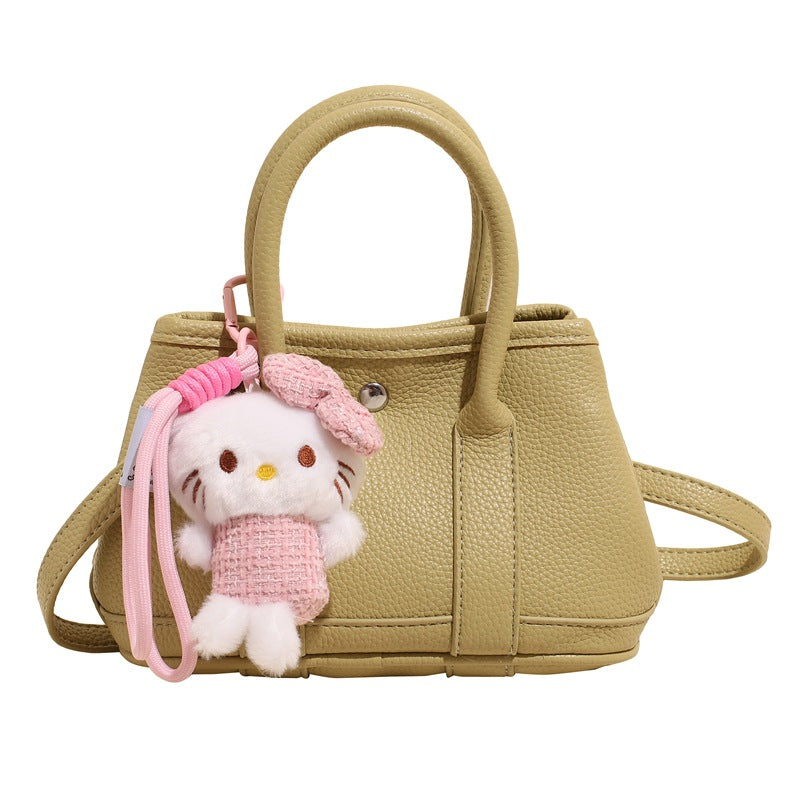 Women’s mini handbag with playful plush pendant
