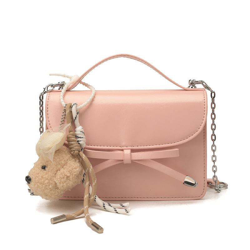 Women elegant mini handbag with cute pendant
