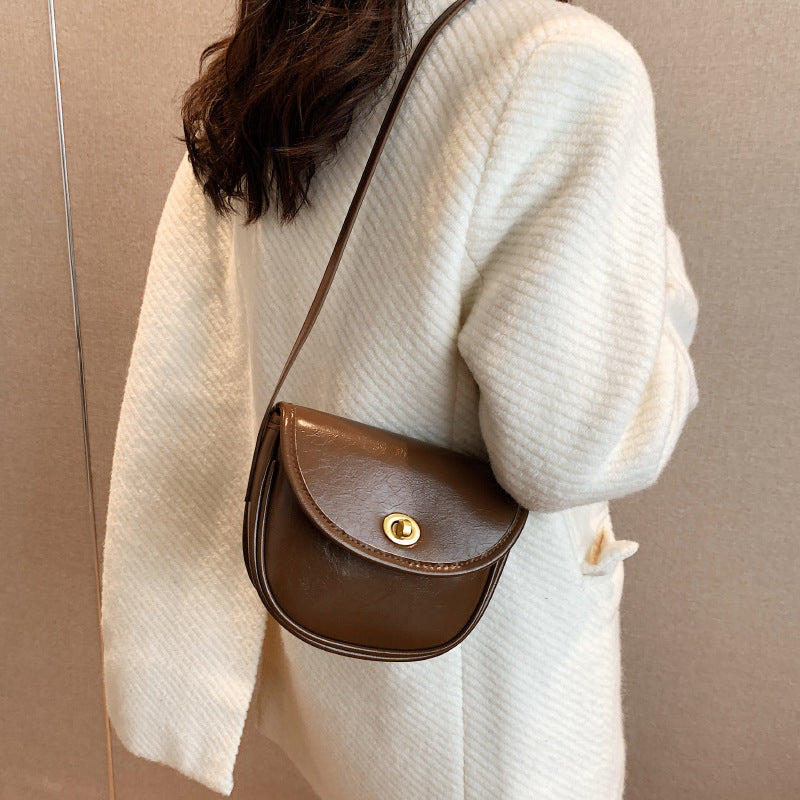Women's shoulder bag in elegant retro design with golden accents