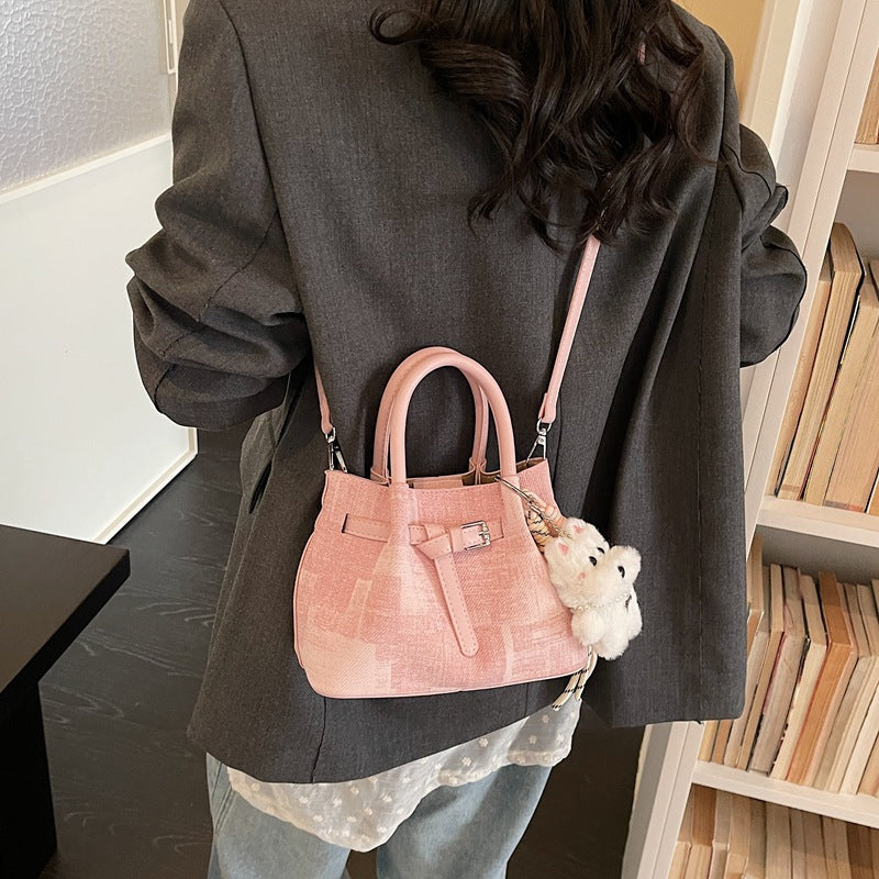 Women’s mini handbag with modern accents and practical interior organizer