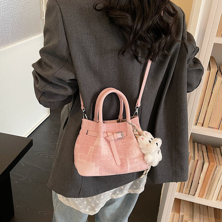 Women’s mini handbag with modern accents and practical interior organizer