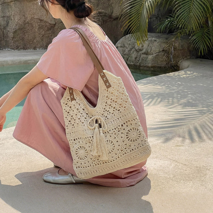 Ladies' crochet shoulder bag with playful fringes and decorative details