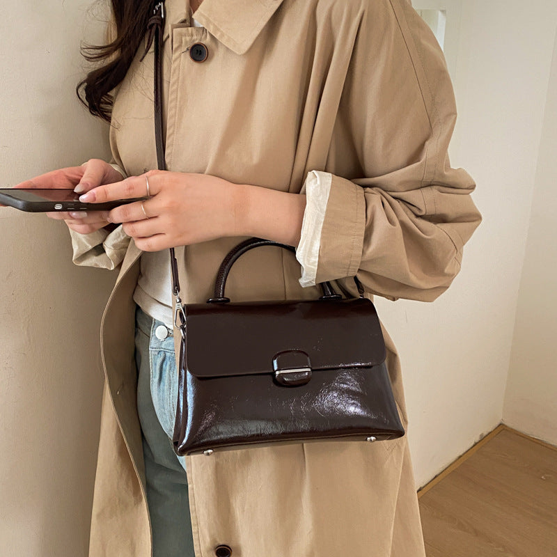 Women's handbag with textured design and elegant closure