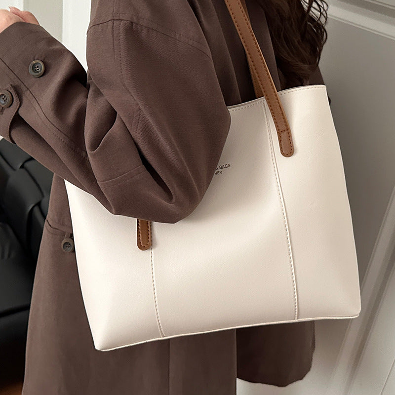 Women's elegant tote bag made of high-quality faux leather with distinctive design