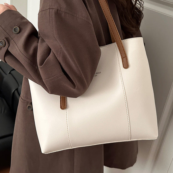 Women's elegant tote bag made of high-quality faux leather with distinctive design