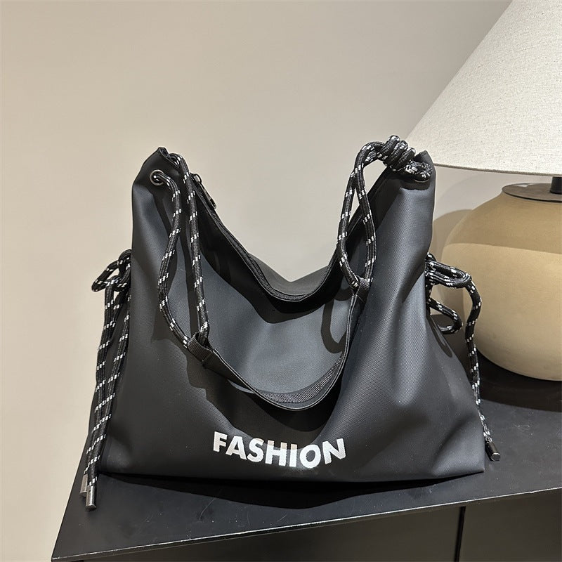 Women's stylish tote bag with braided drawstring